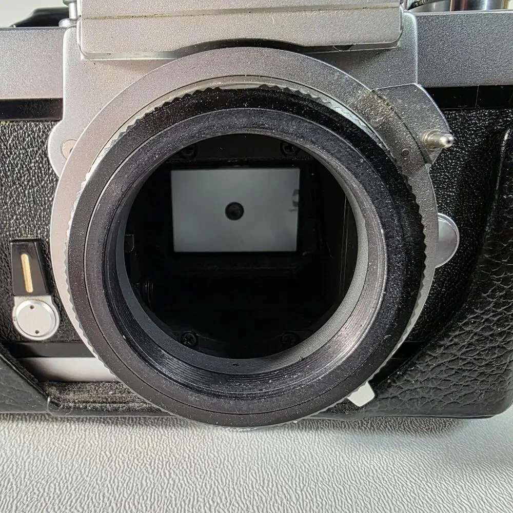 Nikon Nikkormat FT Film Camera Silver with Half Case & Accura 500mm Lens